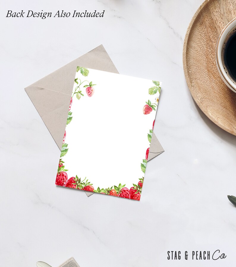 May include: A white card with a red strawberry border. The card has the text "STAG & PEACH Co" at the bottom.