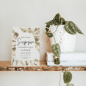 May include: A white card with a green and brown floral design. The card says "Join us for a Surprise Retirement Party in honor of Suzie Briggs July 5th from 5 PM".