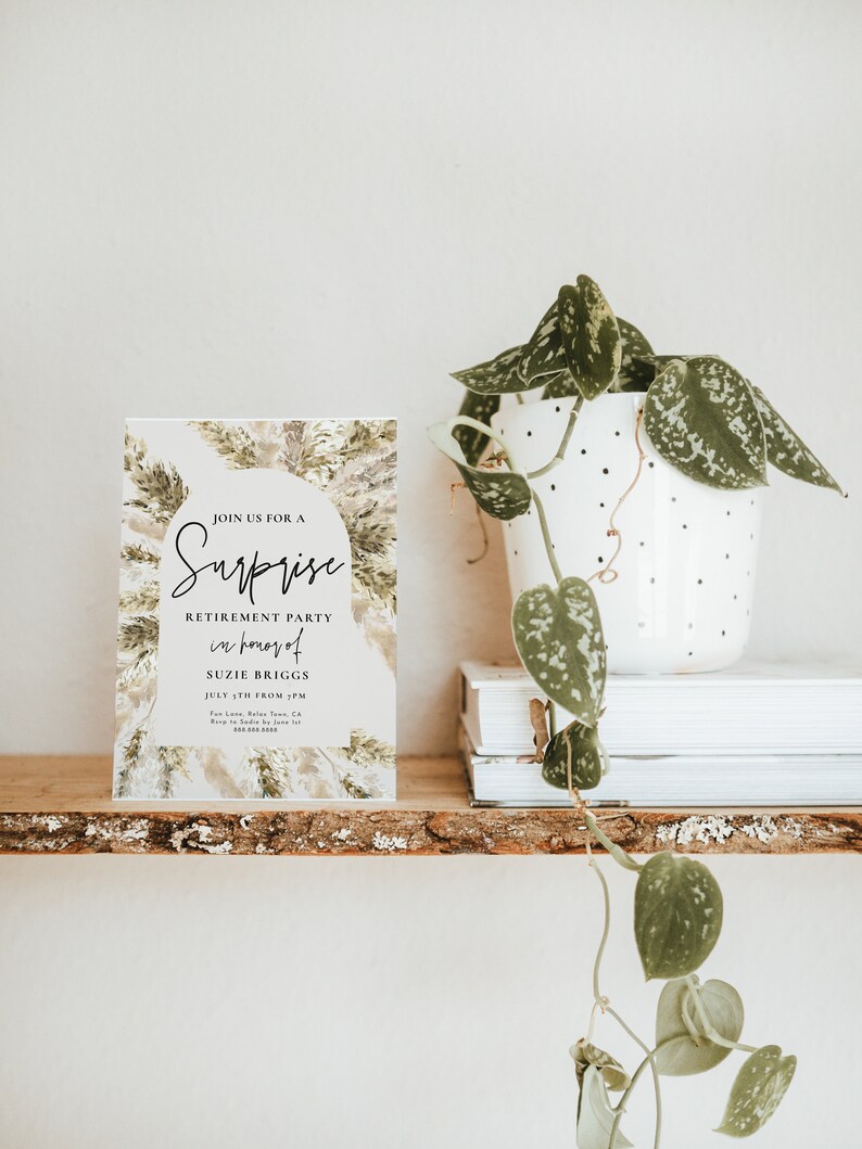 May include: A white card with a green and brown floral design. The card says "Join us for a Surprise Retirement Party in honor of Suzie Briggs July 5th from 5 PM".