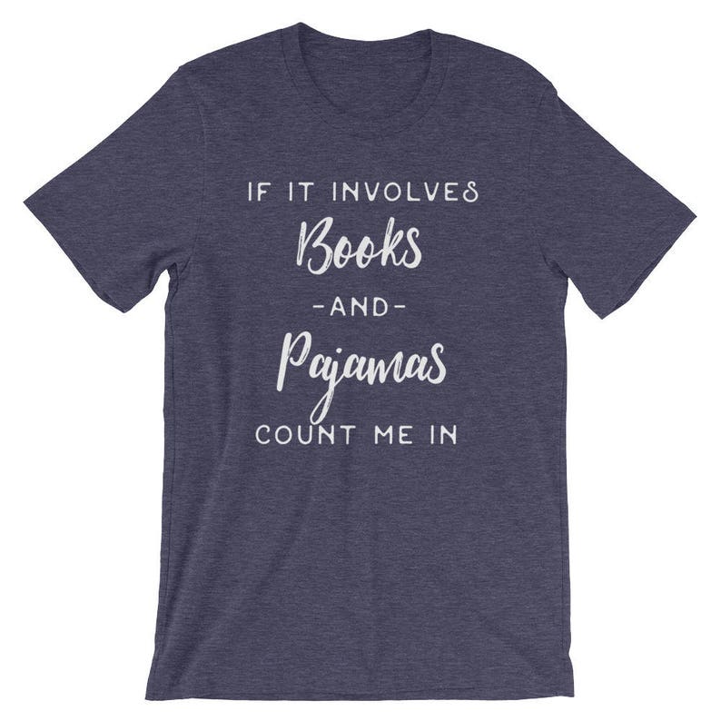 May include: A navy blue t-shirt with white text that reads "If it involves books and pajamas count me in".