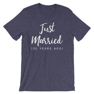 May include: A navy blue t-shirt with the text "Just Married (30 Years Ago)" in white.