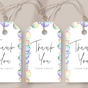 May include: Three white gift tags with a border of watercolor rainbow bubbles. Each tag says "Thank You" and "From Emily".