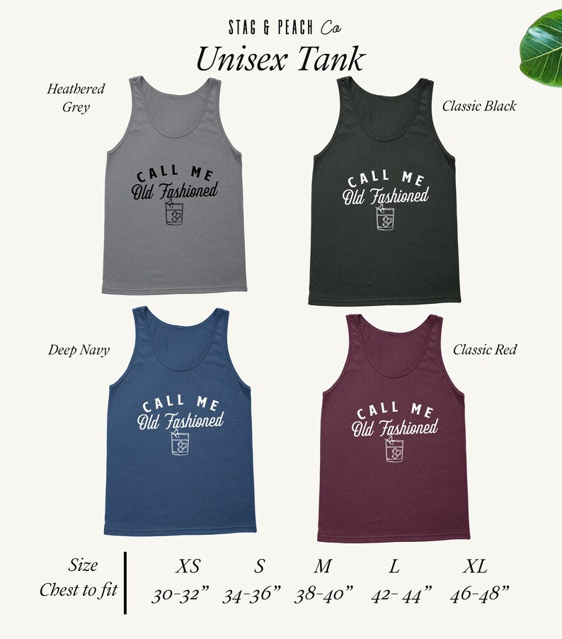 May include: Unisex tank top in four colors: heather grey, classic black, deep navy, and classic red. The tank top features the text "Call Me Old Fashioned" with a cocktail glass graphic. Size chart with chest measurements in inches: XS (30-32), S (34-36), M (38-40), L (42-44), XL (46-48).