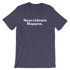 May include: A dark blue t-shirt with the text "Snaccidents Happen." printed in white.
