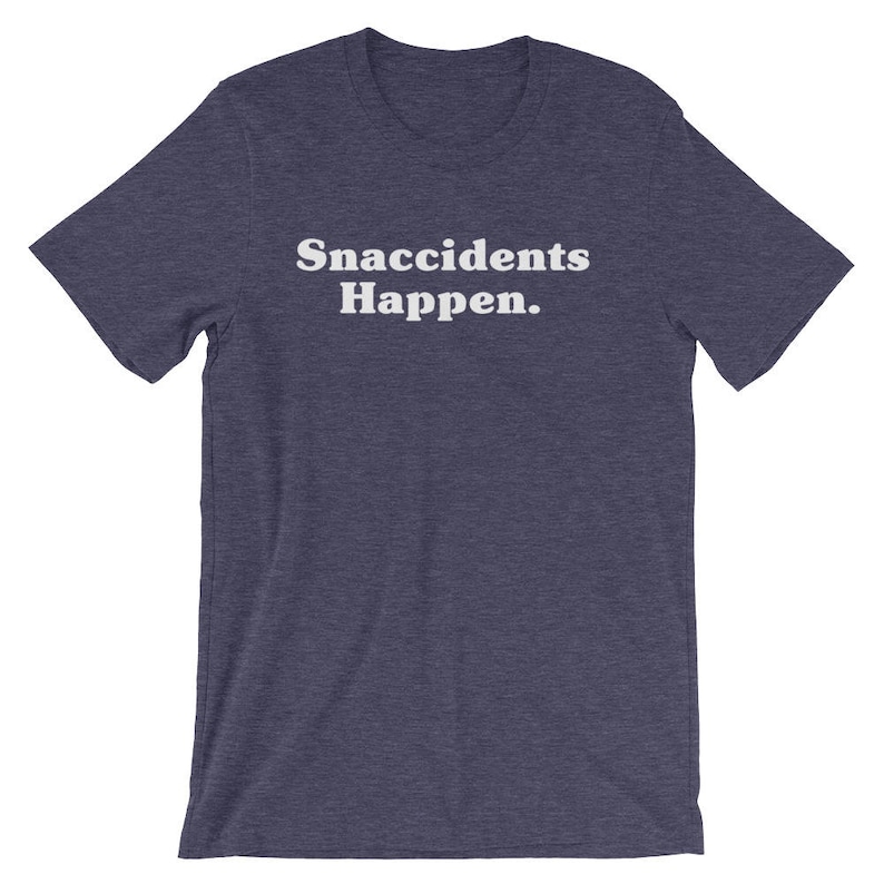 May include: A dark blue t-shirt with the text "Snaccidents Happen." printed in white.
