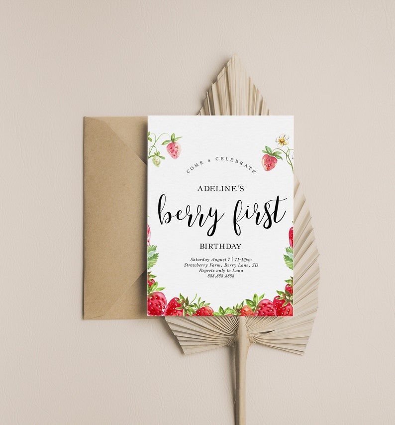 May include: A white invitation card with a watercolour illustration of strawberries and flowers. The text reads "Come Celebrate Adeline's Berry First Birthday" with the date, time, location, and contact information for regrets.