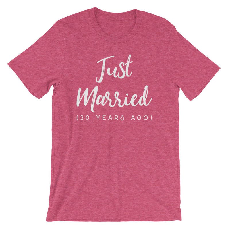 May include: A pink heather t-shirt with the text "Just Married (30 Years Ago)" in white.