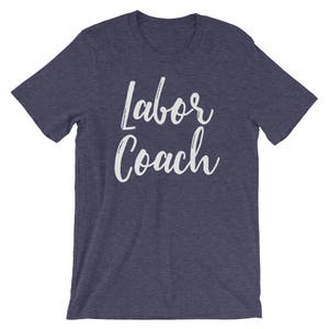 May include: A navy blue t-shirt with the text "Labor Coach" in white lettering.