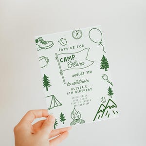 May include: A white invitation card with green illustrations and text. The card reads "Join us for Camp Olivia" and includes camping-themed graphics like a tent, trees, and a campfire. The invitation is for Olivia's 5th birthday.