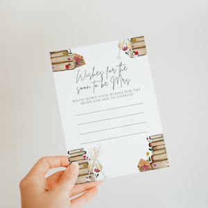 May include: A white card with a floral design and the text "Wishes for the soon to be Mrs."  Write down your wishes for the bride for her to cherish.