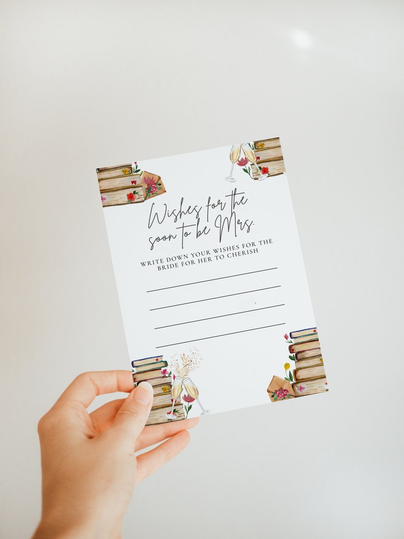 May include: A white card with a floral design and the text "Wishes for the soon to be Mrs."  Write down your wishes for the bride for her to cherish.