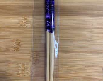 Purple, white, and gold resin on bamboo chopsticks