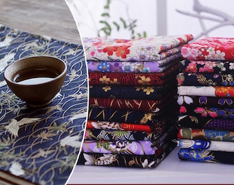 May include: A stack of colorful cotton fabric with floral and geometric patterns. The fabric is 100% cotton and is perfect for quilting, sewing, and crafting.
