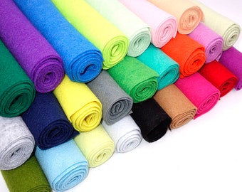 May include: A collection of 20 rolls of felt fabric in various colors, including green, blue, purple, yellow, orange, red, pink, and white. The rolls are arranged in a staggered pattern, with the ends of the rolls facing the viewer.