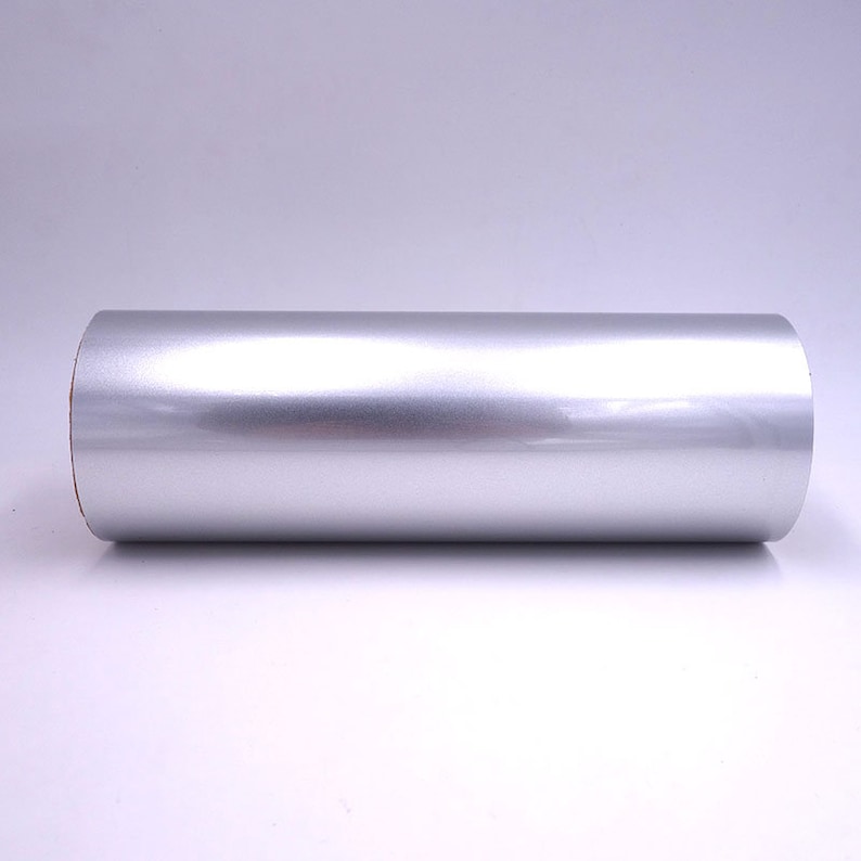 May include: A roll of silver vinyl wrap. The vinyl is smooth and shiny.