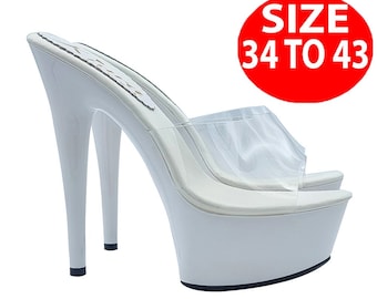 May include: White platform heels with a clear strap and a high stiletto heel. The shoes are available in sizes 34 to 43.
