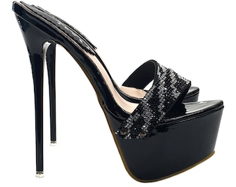 May include: Black platform heels with a rhinestone-embellished strap. The heels are very high and have a stiletto shape.