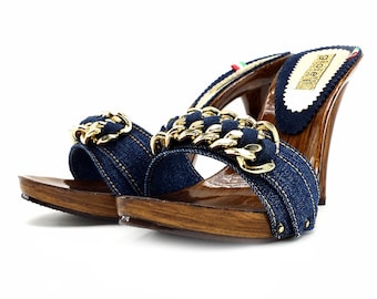 May include: Blue denim heeled sandals with a gold chain detail and wooden platform soles.