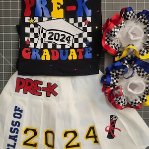May include: A white pleated skirt with the text "PRE-K CLASS OF 2024" in blue, red, and yellow. The skirt has a red, white, and blue bow with black and white checkered ribbon on the side.