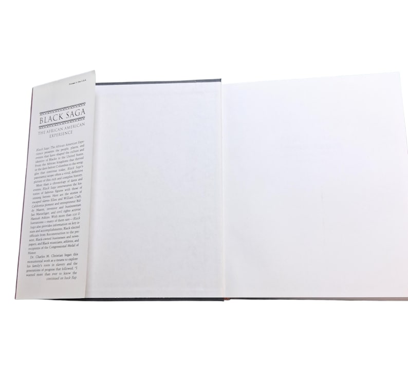 May include: An open book titled "Black Saga: The African American Experience." The book has a black cover and white pages. The title is printed in black and white. The book is open to show blank pages.