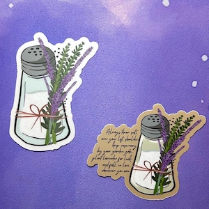 May include: Two stickers featuring a salt shaker with lavender sprigs. The text on the sticker reads "Always throw salt over your left shoulder. Keep rosemary by your garden gate. Plant lavender for luck, and fall in love wherever you can."