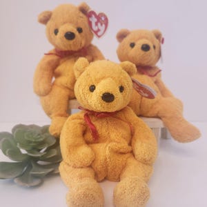 Poopsie The Bear /  Ty Beanie Baby /01/Yellow Chenille with Red Ribbon