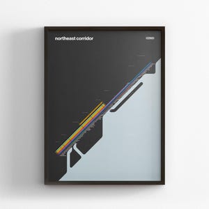 May include: Framed art print with a graphic of the Northeast Corridor. The artwork has a black background with a light blue and white shape. The text "northeast corridor" is displayed in white.