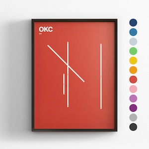 Puede incluir: Impresión artística enmarcada con fondo rojo y líneas geométricas blancas. La palabra "OKC" está en blanco en la parte superior izquierda. Una paleta de colores de puntos está en el lado derecho del marco.