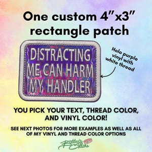 May include: A rectangular 10.16 cm by 7.62 cm custom patch featuring a holographic purple vinyl base with white embroidered text that reads DISTRACTING ME CAN HARM MY HANDLER. The patch has a white stitched border and a metallic finish.