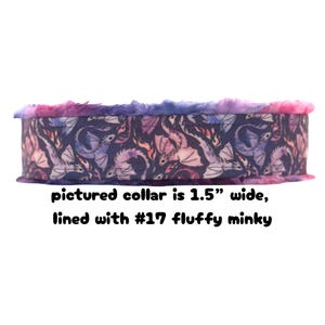 May include: A 1.5-inch wide dog collar with a dragon pattern on a dark background. The collar is lined with fluffy minky fabric and has a purple, pink, and blue color scheme.