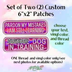 May include: Set of two custom patches, each measuring 15cm x 5cm. One patch reads "PARDON MY MISTAKES I AM STILL LEARNING", the other says "SERVICE DOG IN TRAINING". The patches are pink with white text and a white border.