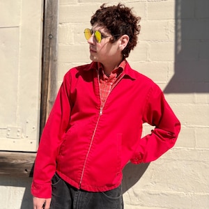 May include: A set of three ceramic mugs with a speckled, matte finish. The mugs are in shades of cream, light gray, and dark gray. Each mug has a simple, minimalist design, perfect for coffee or tea.