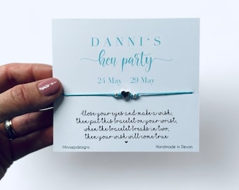 May include: A blue and silver friendship bracelet with the text "Close your eyes and make a wish, then put this bracelet on your wrist, when the bracelet breaks in two, then your wish will come true". The card also has the text "DANNI'S hen party 24 May - 29 May" and "Minniepdesigns. Handmade in Devon".
