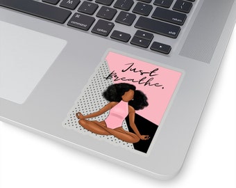 May include: A sticker with a pink background and black polka dots. The sticker features a woman with dark skin and curly black hair sitting in a yoga pose. The text "Just Breathe." is written in black cursive.