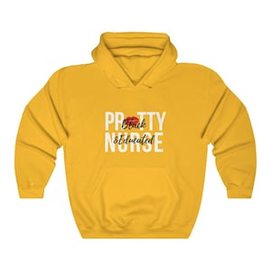 May include: Yellow hoodie with a white graphic that says "Pretty Black & Educated Nurse" with a red lip print above the text.