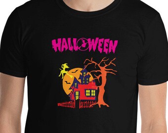 May include: Black t-shirt with a Halloween graphic. The design features a haunted house, a witch on a broom, and a full moon. The word "HALLOWEEN" is printed in pink above the graphic.