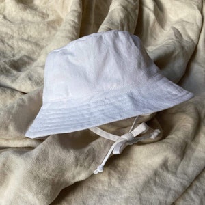 Witte emmerhoed pasgeboren - volwassene