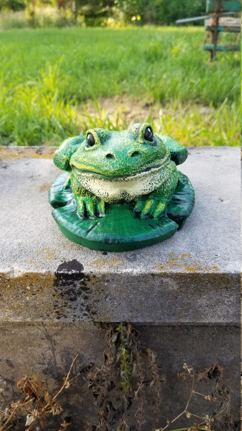 concrete frog statue