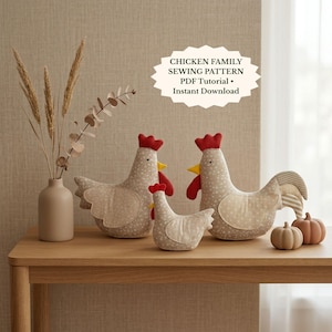 May include: Three fabric chicken figures in varying sizes with beige floral patterns, red combs, and yellow beaks. The text CHICKEN FAMILY SEWING PATTERN PDF Tutorial Instant Download is visible. Two small pumpkins and a vase with dried grass are present.