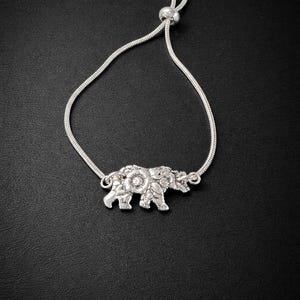 May include: A set of three ceramic mugs with a speckled, matte finish. The mugs are in shades of cream, light gray, and dark gray. Each mug has a simple, minimalist design, perfect for coffee or tea.