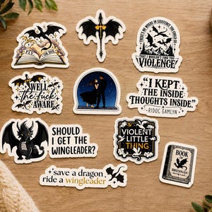 May include: A collection of ten die-cut vinyl stickers featuring black and white illustrations of dragons, silhouettes of people, and text including "Fly or Die," "Well the fuck aware," "I kept the inside thoughts inside," and "Violent little thing."