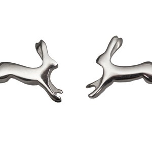 May include: A pair of silver rabbit stud earrings. The rabbits are in a leaping pose.
