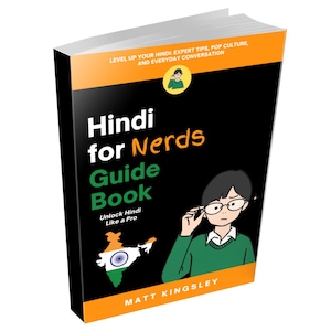 May include: A book titled "Hindi for Nerds Guide Book" with a black cover and orange accents. The cover features a cartoon illustration of a person wearing glasses, and a map of India. The book promises to unlock Hindi like a pro.