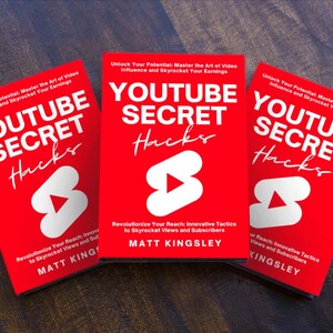 May include: Three red paperback books titled "YouTube Secret Hacks" with a white play button icon. The book covers feature the text "Unlock Your Potential: Master the Art of Video Influence and Skyrocket Your Earnings." The author is Matt Kingsley.