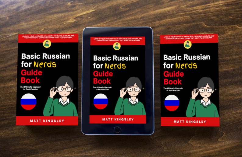 Puede incluir: Imagen de una tableta y dos libros titulados "Basic Russian for Nerds Guide Book". Los libros y la tableta tienen un fondo negro con el t&iacute;tulo en blanco y rojo. La portada presenta una caricatura de una persona con gafas.