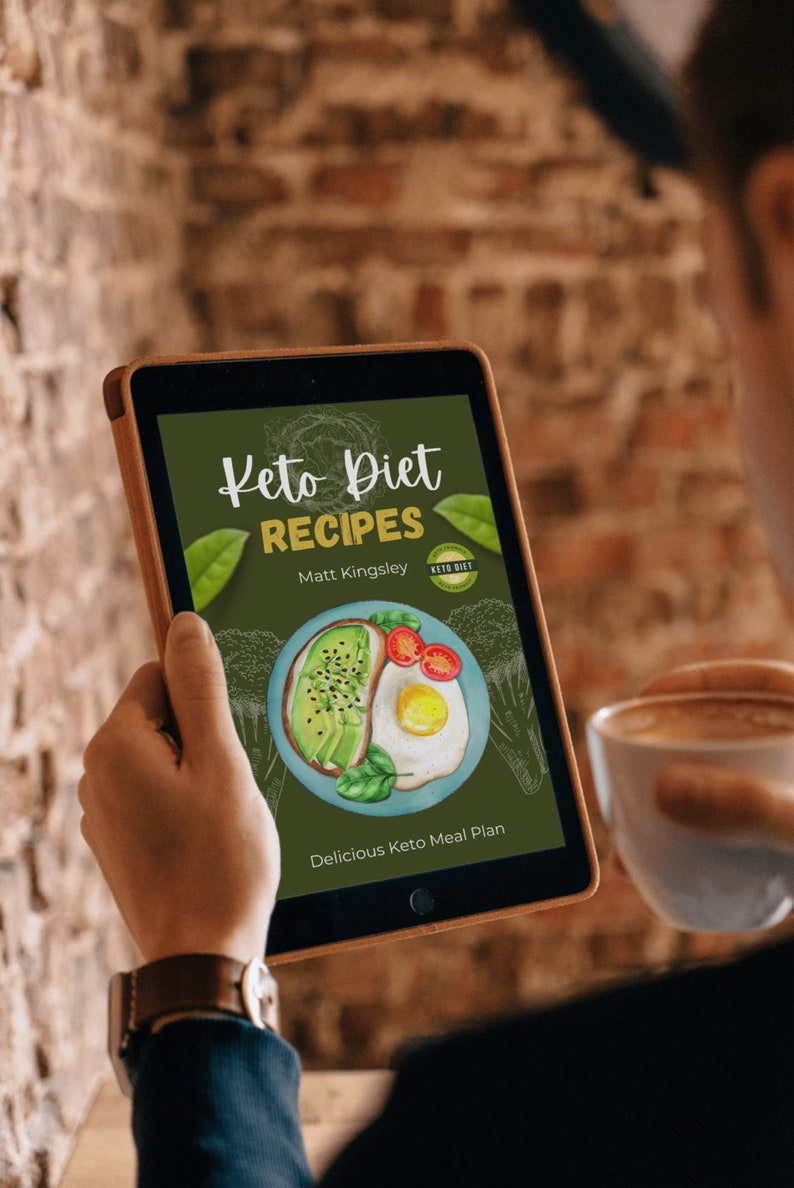 May include: A digital tablet displaying a book cover for "Keto Diet Recipes" by Matt Kingsley. The cover features a green background with a drawing of a plate of avocado toast and a fried egg. The text "Keto Diet" is in a white cursive font and the text "Recipes" is in a white sans-serif font.