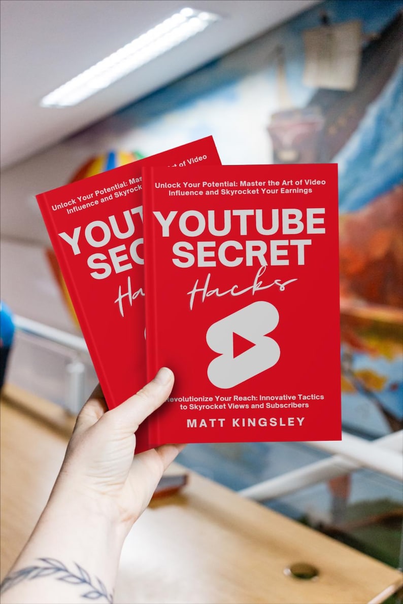 May include: Two red books titled "YouTube Secret Hacks" with a white play button icon on the cover. The book is about unlocking your potential and mastering the art of video influence.