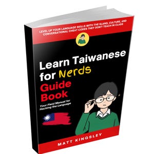 May include: A book titled "Learn Taiwanese for Nerds Guide Book" with a black cover and red accents. The cover features a cartoon illustration of a person wearing glasses, the Taiwanese flag, and the author's name, Matt Kingsley.