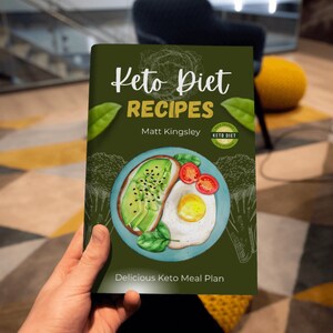 May include: A green book cover with the title "Keto Diet Recipes" and the author's name "Matt Kingsley". The cover features a watercolor illustration of a plate with avocado toast, a fried egg, and cherry tomatoes. The text "Delicious Keto Meal Plan" is at the bottom of the cover.