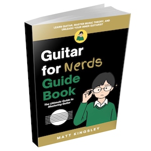 May include: A black and gold book titled "Guitar for Nerds Guide Book" with a cartoon illustration of a person wearing glasses and a green sweater. The book's subtitle is "The Ultimate Guide to Mastering Guitar".